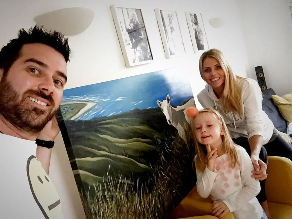 A family from the UK with a Beverley Frost painting