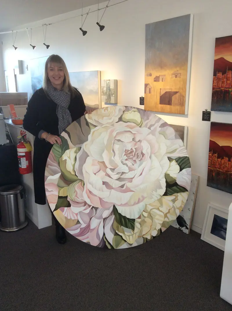 A photo of a Beverley Frost with her Peony painting